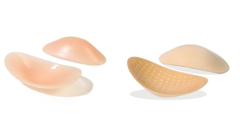 Reusable silicone and foam shoulder pads designed to improve the appearance of sloping shoulders and create a more balanced shoulder silhouette.